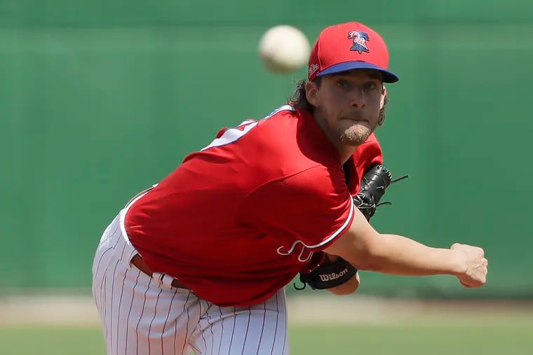 Phillies ace Aaron Nola, shown during spring training back in March, has yet to report to the team's summer camp.