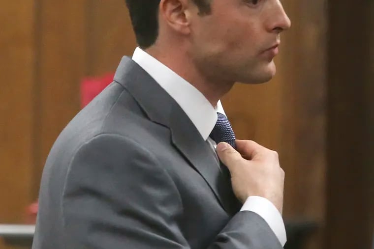 Former Baylor University fraternity president Jacob Anderson adjust his tie in the courtroom Monday Dec. 10, 2018 in Waco, Texas. Mr. Anderson, accused of rape, will serve no jail time after a Waco district judge accepted a plea bargain for deferred probation. (Jerry Larson/Waco Tribune Herald via AP)