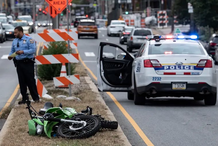 A  dirt bike in the median on North Broad Street. Police said it struck a police car and injured an officer.