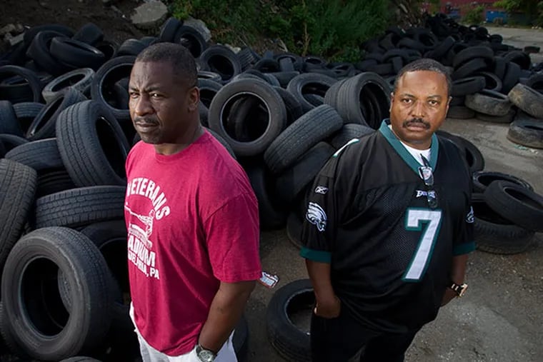 Philadelphia Police officers Robert McCoy and Danny Percell with the Police Neighborhood Services Unit work undercover to catch illegal dumping. ( ALEJANDRO A. ALVAREZ / STAFF PHOTOGRAPHER )