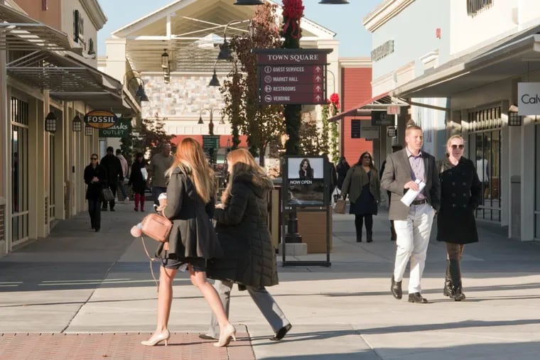 Shoppers peruse the stores at the Gloucester Premium Outlets in Blackwood, N.J. The region’s shopping centers anticipate a big Black Friday, so shoppers should expect crowds.