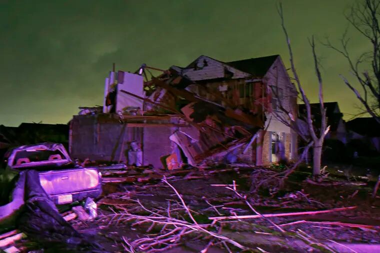A house sits in ruins after a tornado blew through Rowlett, Texas, on Saturday night. Story, A10