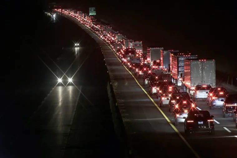 Southbound traffic on NJ Turnpie backed up couple miles before Exit 2 as people need to exit there because Delaware Memorial Bridge closed on November 25, 2018