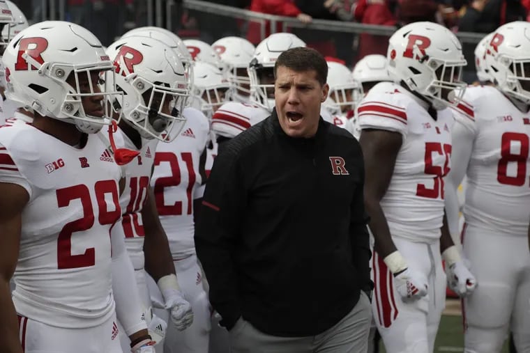 Rutgers head coach Chris Ash leads his team onto the field before the game against Wisconsin on Nov. 3.
