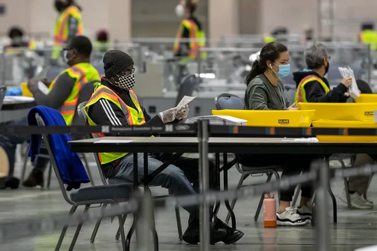 Ballots being unfolded at the Pennsylvania Convention Center in Philadelphia on Nov. 4, 2020.