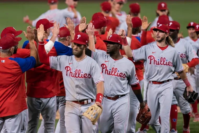 The Phillies celebrating their come-from-behind victory over the Washington Nationals on Monday night.