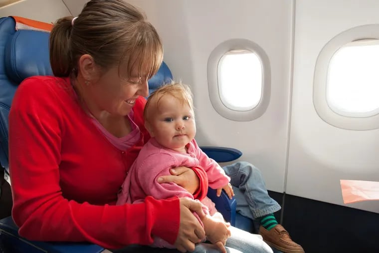 Experts say the safest place for a child on a airplane is in a safety seat and not on a lap.