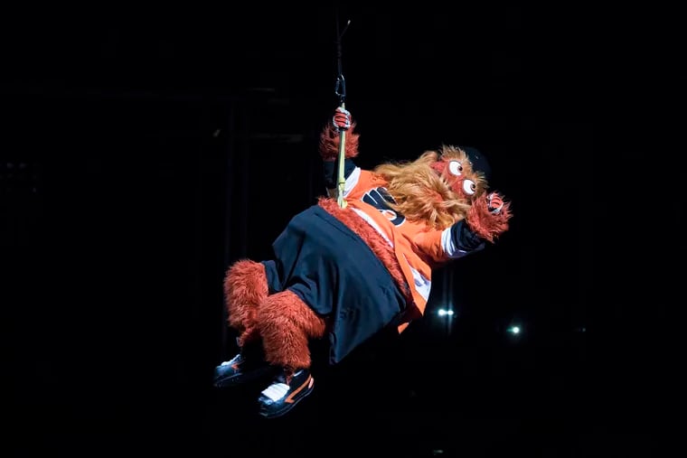 Gritty, the Flyers new mascot makes his appearance descending from the rafters like a wrecking ball.