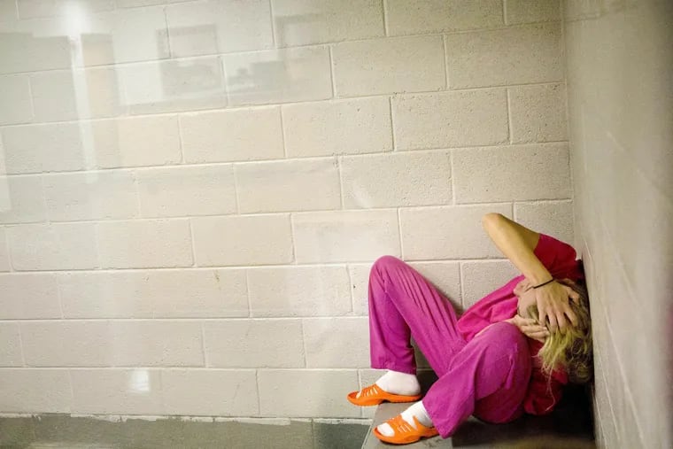 Jessica Morgan, high on methamphetamines and the opioid pain medication Opana, sits in a holding cell after being booked for drug possession at the Campbell County Jail in Jacksboro, Tenn., earlier this spring. More than a decade ago, there were rarely more than 10 women in this jail. Now the population is routinely around 60.