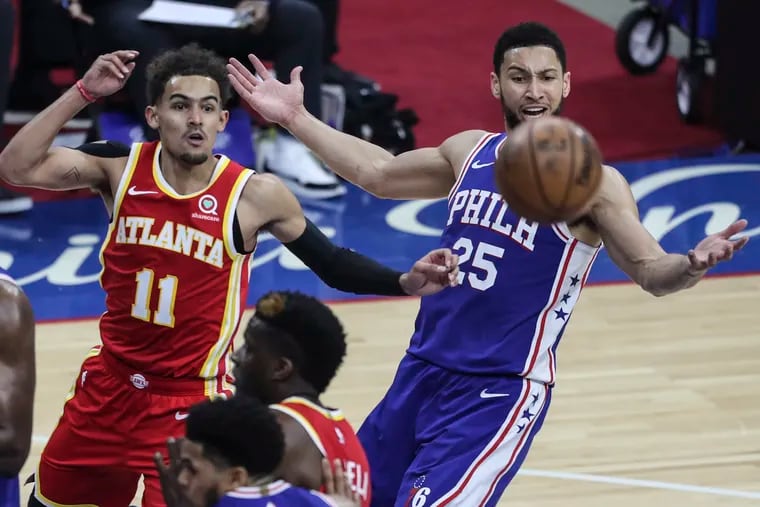 Ben Simmons watches a rebound float by with the Hawks' Trae Young during Game 5.