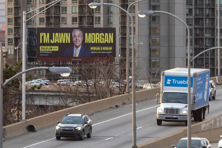 “I’m Jawn Morgan” a Morgan & Morgan law firm billboard is visible from Spring Garden bridge in Philadelphia in March 2022.