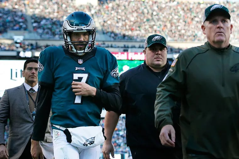 Sam Bradford walks off of the field after being hurt against the Dolphins.