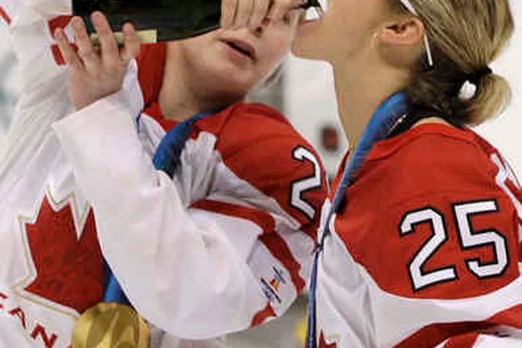 Canada's Haley Irwin (left) and Tessa Bonhomme in a postgame scene an IOC official called &quot;not what we want to see.&quot;