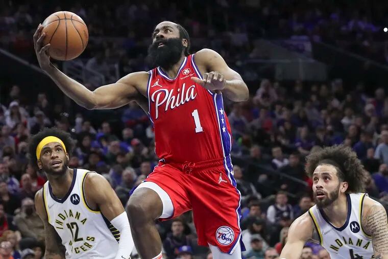 Sixers guard James Harden (1) drives to the hoop past Indiana Pacers forward Oshae Brissett (12) in the second quarter of a game at the Wells Fargo Center on Saturday, April 9, 2022.