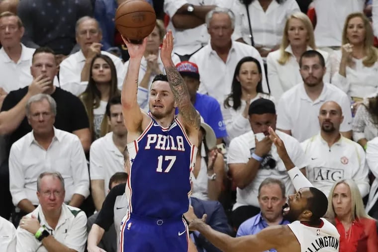 Sixers guard JJ Redick shoots the basketball over Heat guard Wayne Ellington during game four of the Eastern Conference quarterfinals on Saturday.