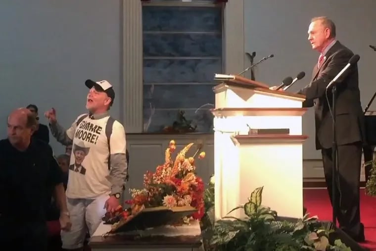 Comedian Tony Barbieri, posing as “Jake Byrd,” disrupted Roy Moore’s Wednesday appearance inside Magnolia Springs Baptist Church near Mobile, Ala.