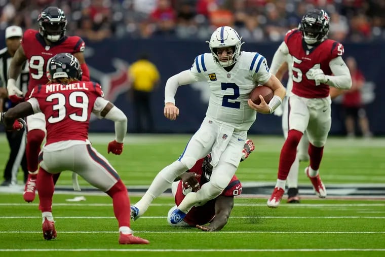 Colts quarterback Carson Wentz (2) takes off and runs against the Texans on Dec. 5. His start on Saturday should give him enough snaps to make a first-rounder out of the conditional draft pick the Eagles received in the trade with Indianapolis all the way back in February.