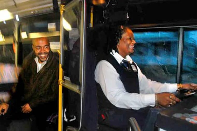 Rider Vincent McNeill talks with driver Evelyn Holley on his early morning commute from 40th Street and Westfield Avenue to downtown Camden. (Tom Gralish / Staff Photographer)