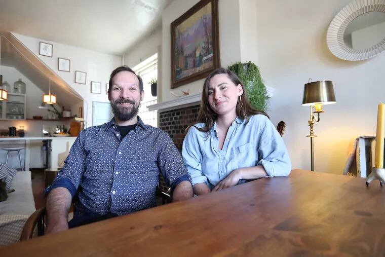 Shannon Retseck and Alex Boatman, at their apartment in the Spruce Hill neighborhood of West Philadelphia.  ( DAVID SWANSON / Staff Photographer )