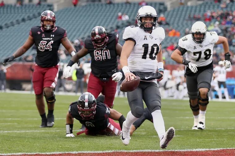 UCF quarterback McKenzie Milton (10) scores a touchdown in the first quarter of a game against Temple at Lincoln Financial Field on Saturday, Nov 18, 2017. TIM TAI / Staff Photographer