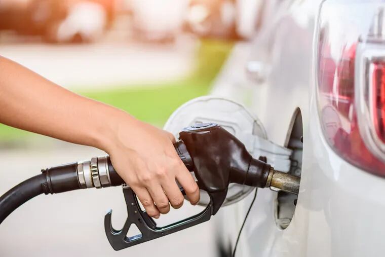 If you keep pumping gas once the nozzle clicks off, you may be forcing liquid into the car's carbon pollution canister. That can cause problems. (Dreamstime / TNS)