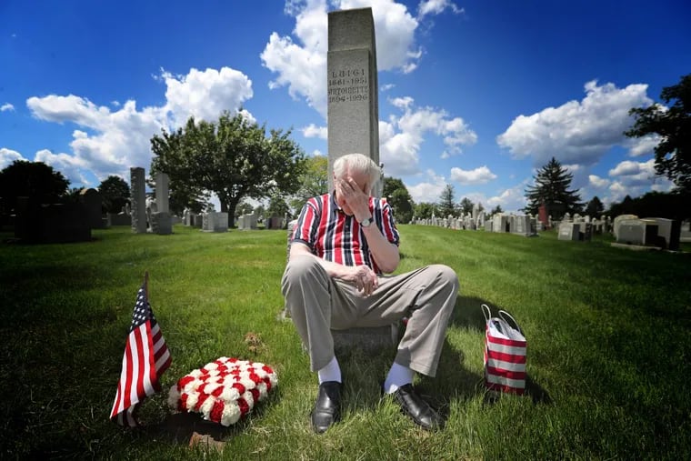 Korean War vet Donald Bustard reads a letter on the grave of a war buddy whose death 66 years ago has haunted Bustard all these years.