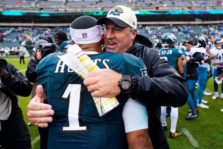 Philadelphia Eagles' Jalen Hurts is embraced by Jacksonville Jaguars' head coach Doug Pederson after the Eagles defeated the Jaguars.