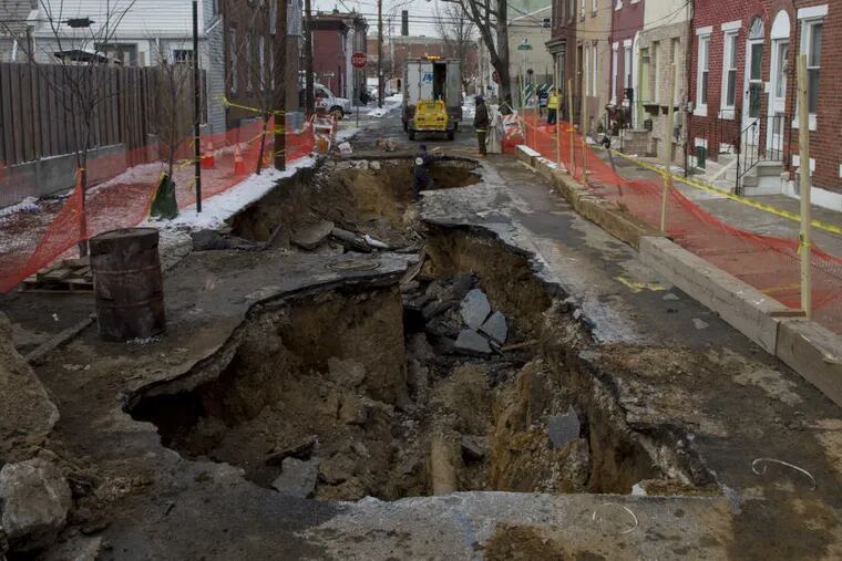 A large sinkhole on the 2300 block of East Boston Street opened on Sunday morning after a water main broke. Residents say community spirit has helped them endure the lack of water and gas.