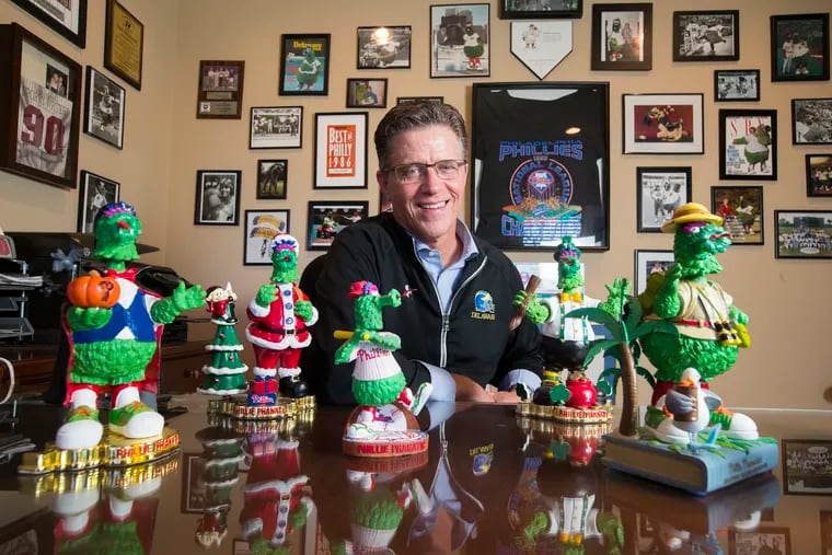Dave Raymond, the original Phillie Phanatic whose mascot company not only devised the Flyers' controversial Gritty but has recently made one for a giant pharmaceutical company, the Irritable Bowel. He is shown in his home office on Oct. 12, 2018, with some of his Phanatic paraphenalia.