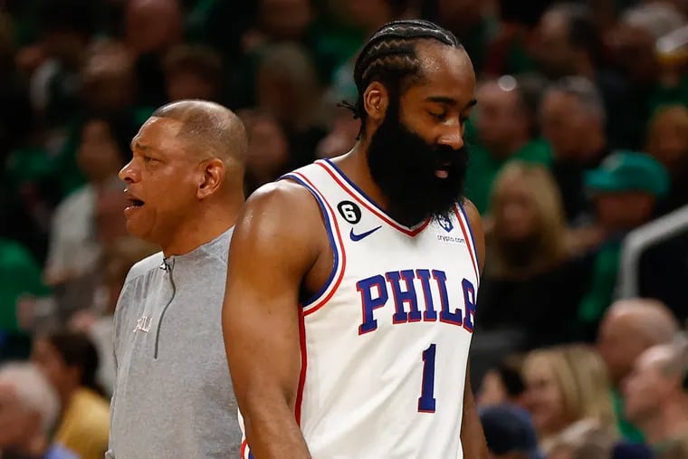 Sixers guard James Harden walks past coach Doc Rivers during the blowout loss to the Boston Celtics in Game 7 on Sunday.