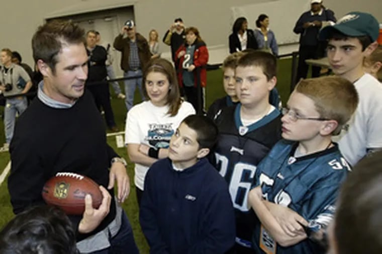 A.J. Feeley interacts with children participating in Eagles&#0039; &#0039;junior combine&#0039; at the NovaCare Complex.