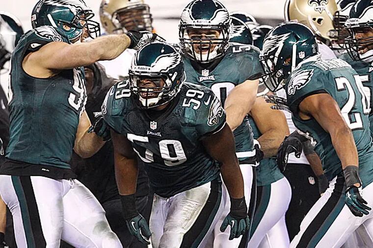 Eagles linebacker DeMeco Ryans is congratulated by teammates Connor Barwin. (Ron Cortes/Staff Photographer)