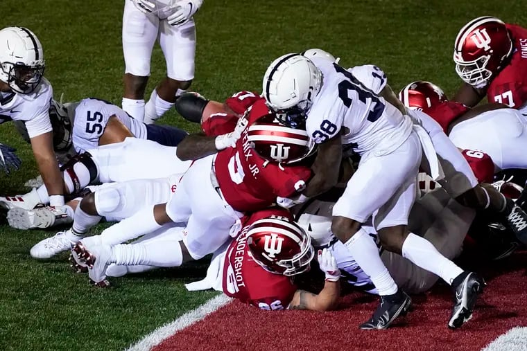 Indiana quarterback Michael Penix Jr. (9) goes in for a touchdown as he is tackled by Penn State's Lamont Wade (38).