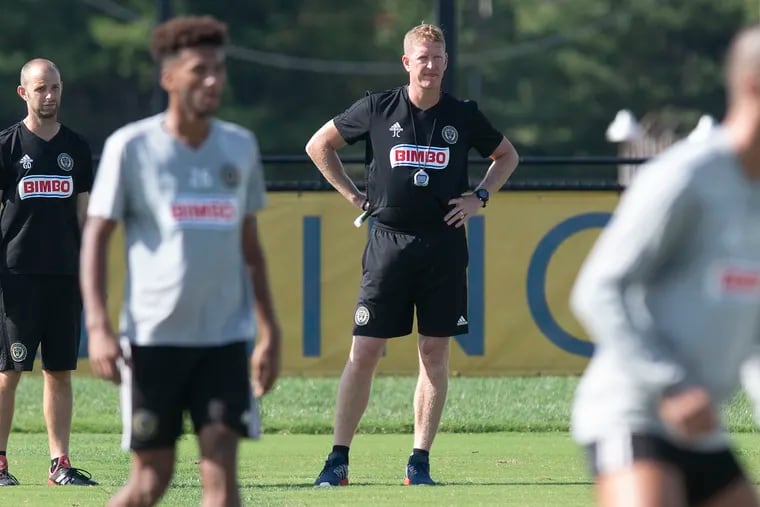 Jim Curtin watches over a recent practice on the fields outside Talen Energy Stadium. His team is close to securing its first home playoff game in seven years.