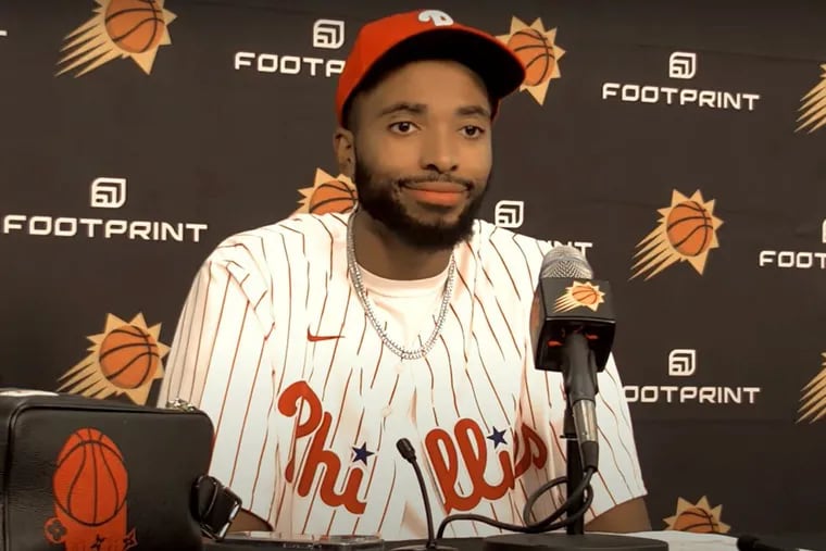 The Phoenix Suns' Mikal Bridges wears a Phillies jersey after one of his team's games, which coincided with Game 1 of the World Series.