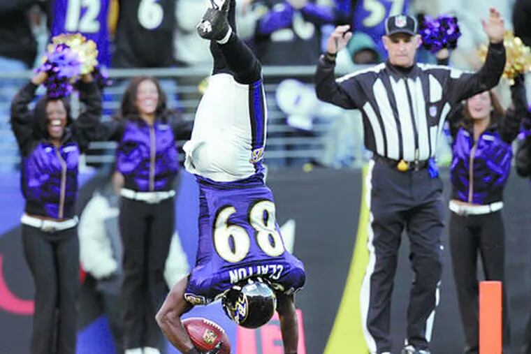 The Ravens&#0039; Mark Clayton flips into the end zone for a 53-yard TD reception that gave Baltimore a 22-7 lead. He left cornerback Lito Sheppard behind on that play.