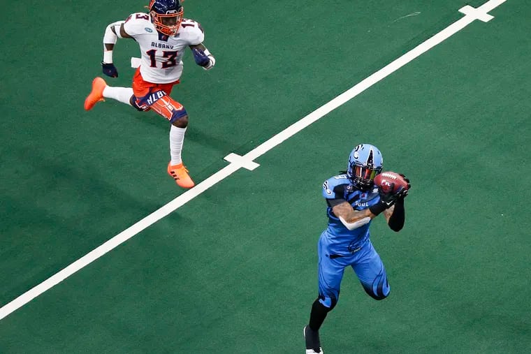 Soul wide receiver Lonnie Outlaw catches a touchdown pass in the third quarter after getting behind Albany Empire defensive back Juwan Offray.