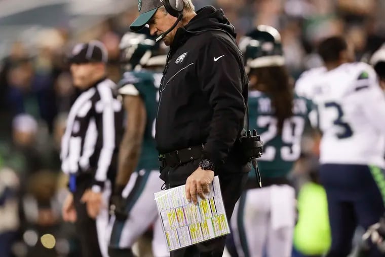 Eagles head coach Doug Pederson walks off the field after checking on injured defensive end Brandon Graham during the first-quarter against the Seattle Seahawks in a NFC Wild Card playoff game on Sunday, January 5, 2020 in Philadelphia.