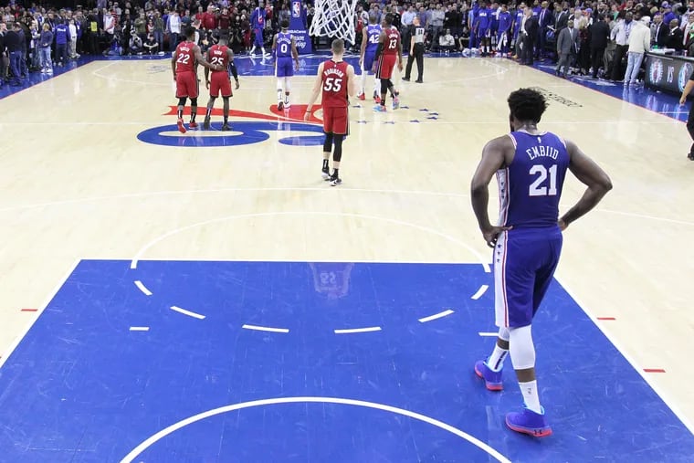 Joel Embiid walks down the court in the final moments of the Sixers' loss to the Heat at the Wells Fargo Center on Dec. 18, 2019.