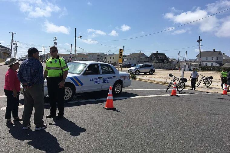 On Porter Avenue at the border of Seaside Park and Seaside Heights police were turning away everyone - in motor vehicles or on foot - from entering or leaving Seaside Park