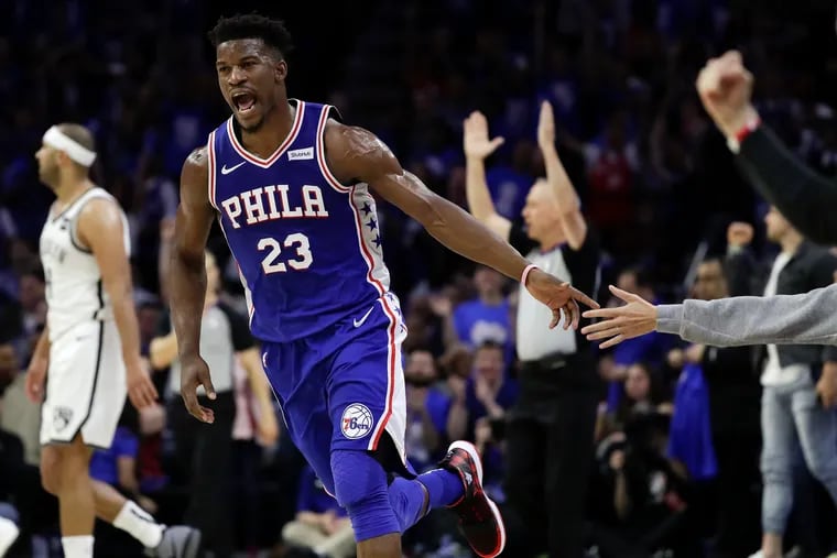 Sixers guard Jimmy Butler celebrates his made three point basket at the end of the first-half against the Brooklyn Nets in game one of the Eastern Conference playoffs on Saturday, April 13, 2019 in Philadelphia.