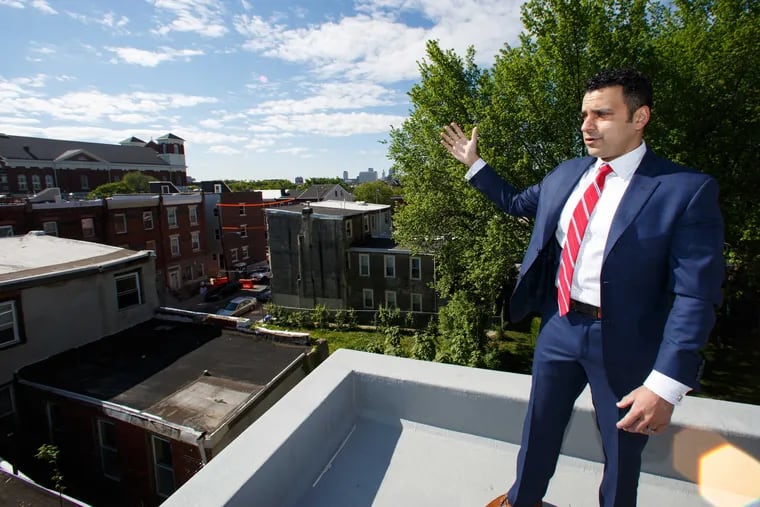 Rahil Raza stands on the roof deck of a property located at 1910 Ingersoll Street, in Philadelphia, Monday, May 8, 2017.