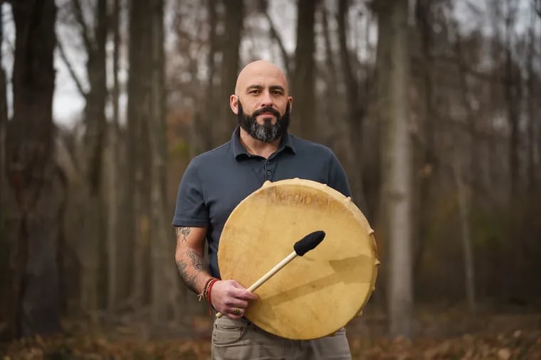 Stephen Kavalkovich with a drum he uses in his work as shamanic practitioner.