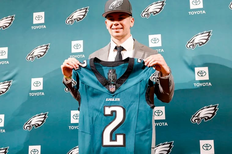 Eagles second-round pick Cooper DeJean holds his jersey after meeting with the media during a introduction press conference at the NovaCare Complex.