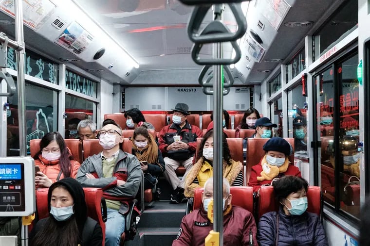 Taiwanese Citizens in Taipei City Bus wearing a mask in order to protect themselves from Corona Virus (2019-nCoV) in Tapei, Taiwan. (Jose Lopes Amaral/NurPhoto via Getty Images/TNS)
