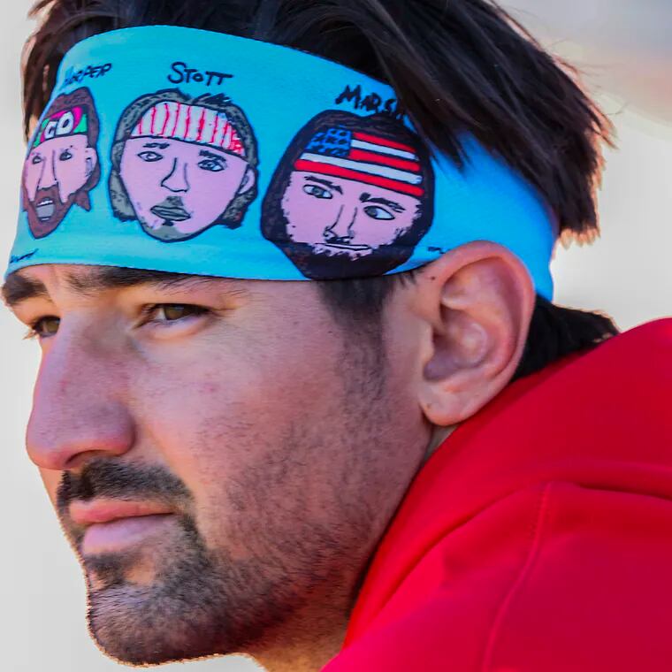Phillies outfielder Nick Castellanos wears a headband designed by his son Liam. It features Castellanos and a trio of Phillies teammates.