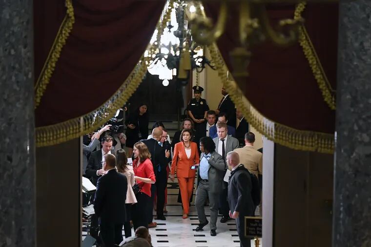 House Speaker Nancy Pelosi, D-Calif., walks down a hallway of the Capitol after the impeachment-inquiry vote Thursday, Oct. 31, 2019.