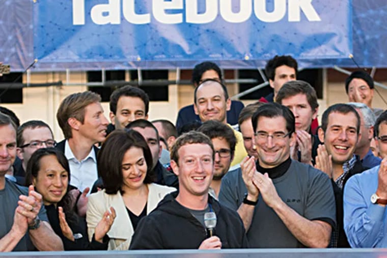 Facebook CEO Mark Zuckerberg (center) at the Nasdaq opening of trading in the firm’s stock. ZEF NIKOLLA / Facebook