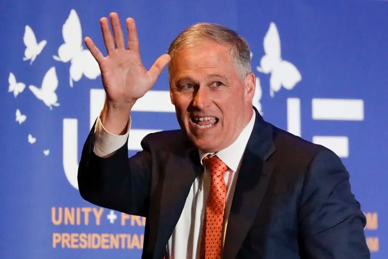 In a file photo, Washington Gov. Jay Inslee waves in May after speaking during a presidential campaign event at the Unity Freedom Presidential Forum in Pasadena, Calif. Inslee, who made fighting climate change the central theme of his campaign, announced Wednesday, Aug. 21, 2019, that he was ending his bid for the 2020 Democratic nomination.