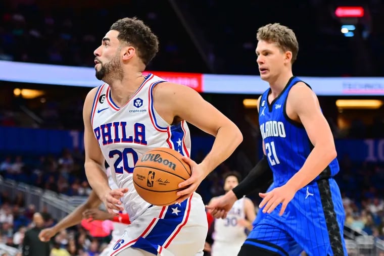 Georges Niang of the 76ers goes to the basket past Moritz Wagner (21) of the Orlando Magic in the first half.
